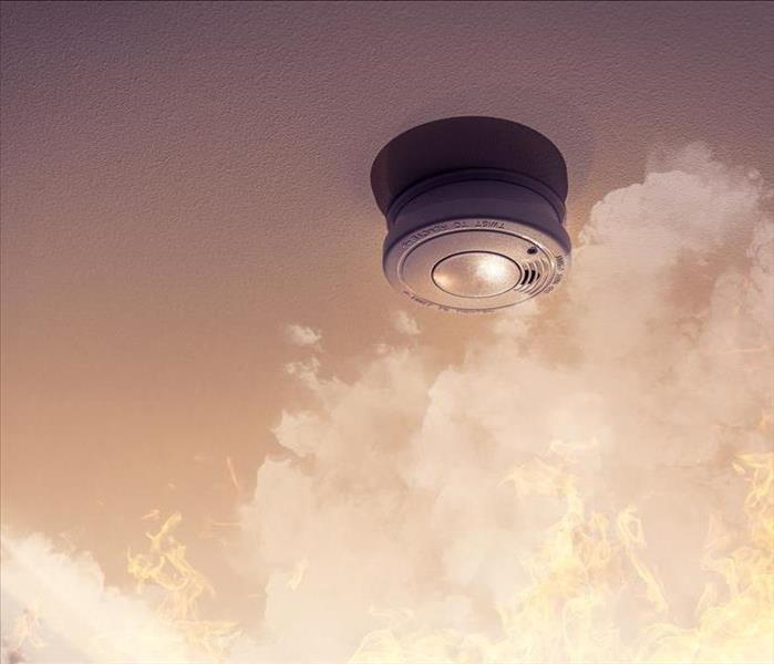smoke detector on ceiling detecting house fire
